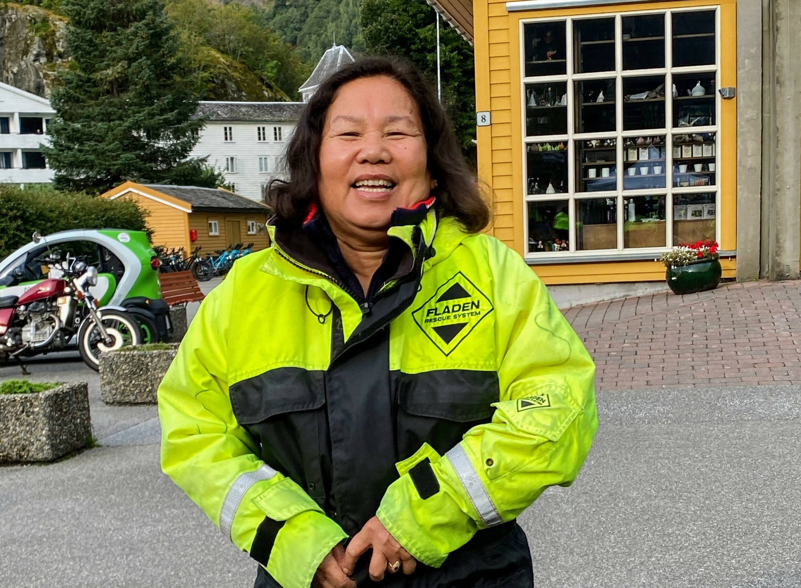 Ruchipa stands outside in a thermal suit and smiles