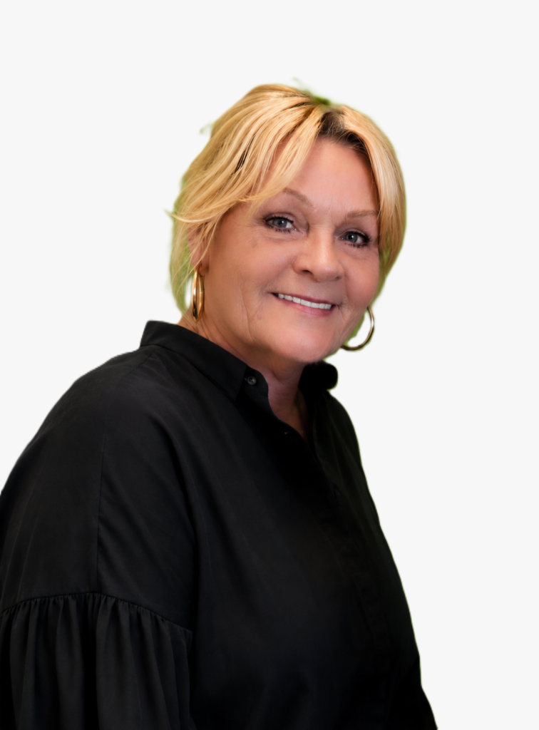 Photograph of Inger Lise Vincent. She has light hair tied up, with a centre parting at the front. Earrings and a black blouse.